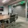 Large well lit meeting room with a long table and very modern decorations.
