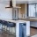 Spacious and well lit kitchen with wood floors and stainless steel appliances. 