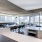 Spacious and well lit community kitchen with large community table