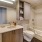 bright vanity counter and shower/tub combo in bathroom