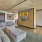 large couch in front of wall mounted tv in clubhouse