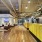 spacious mail center with exposed ceiling and canned lighting throughout