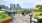 tables and chairs on rooftop terrace with city views