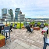 spacious rooftop terrace with social areas and city views